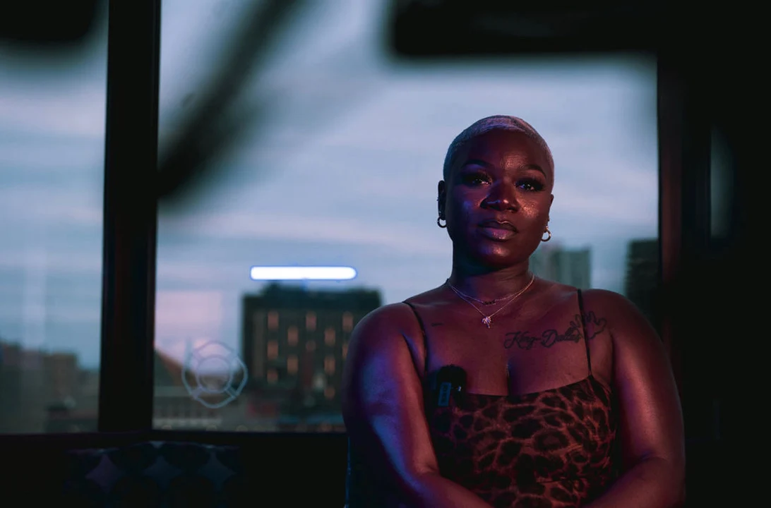 The founder seated for an intimate conversation against a city skyline